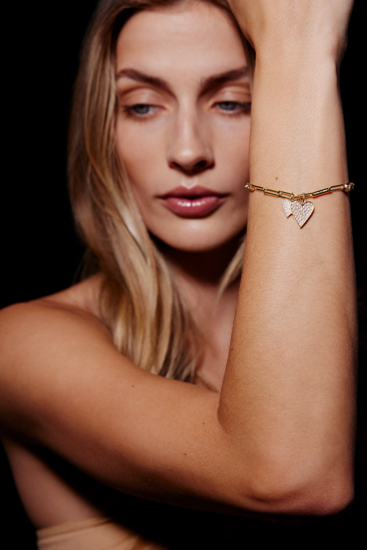women wearing charm bracelet