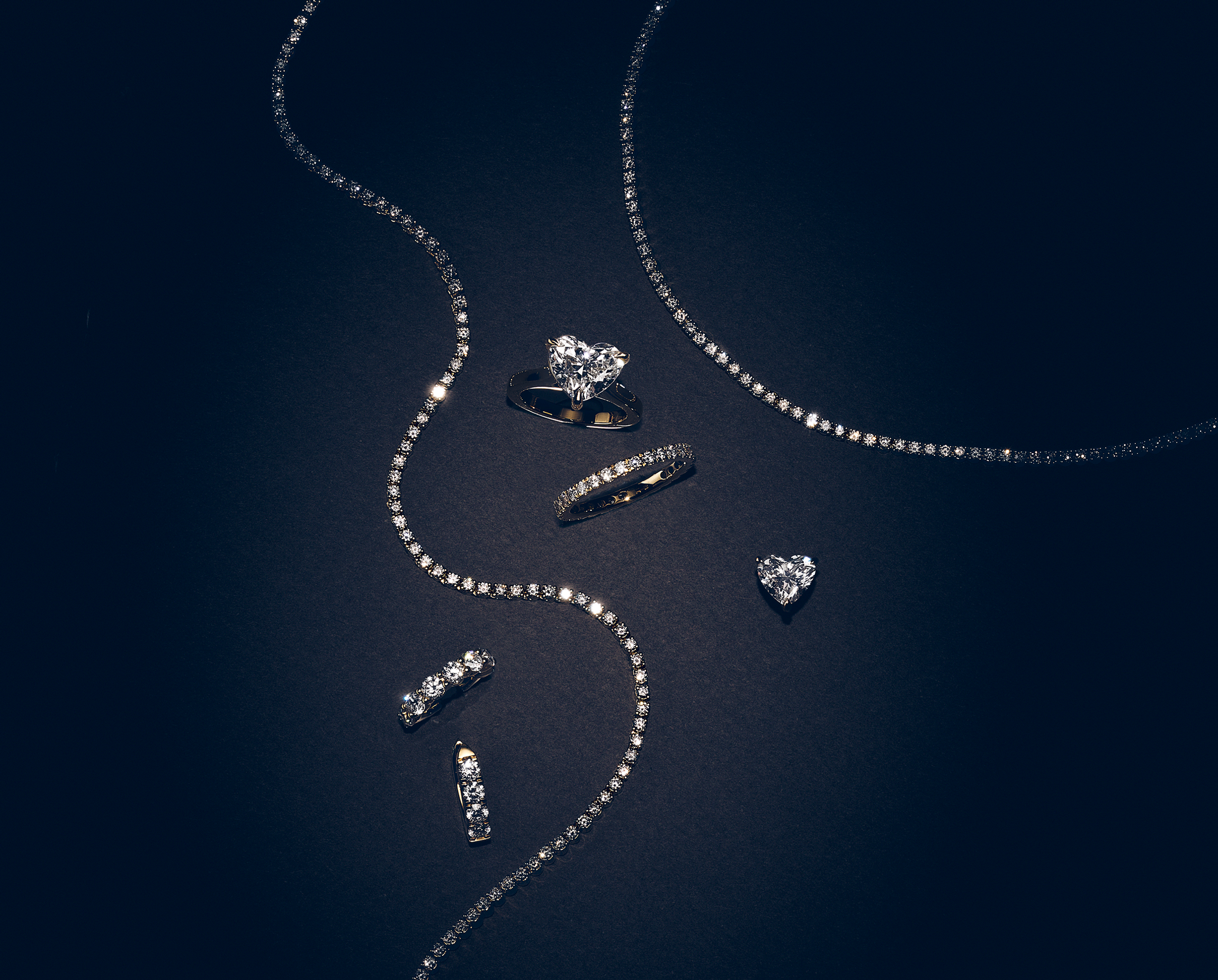 Lab Diamonds floating across page on a grey background