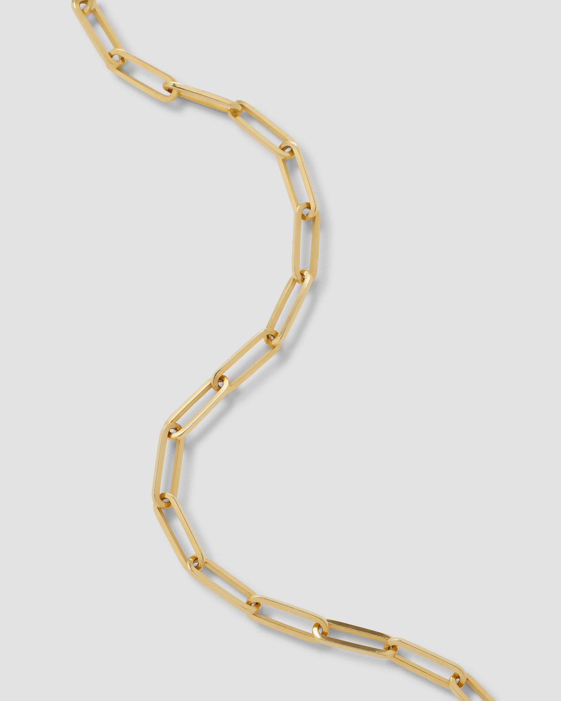 Long link chain on a grey background