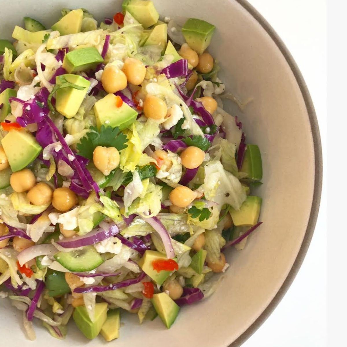 Salad with cabbage, avocado, chickpeas, in a bowl.