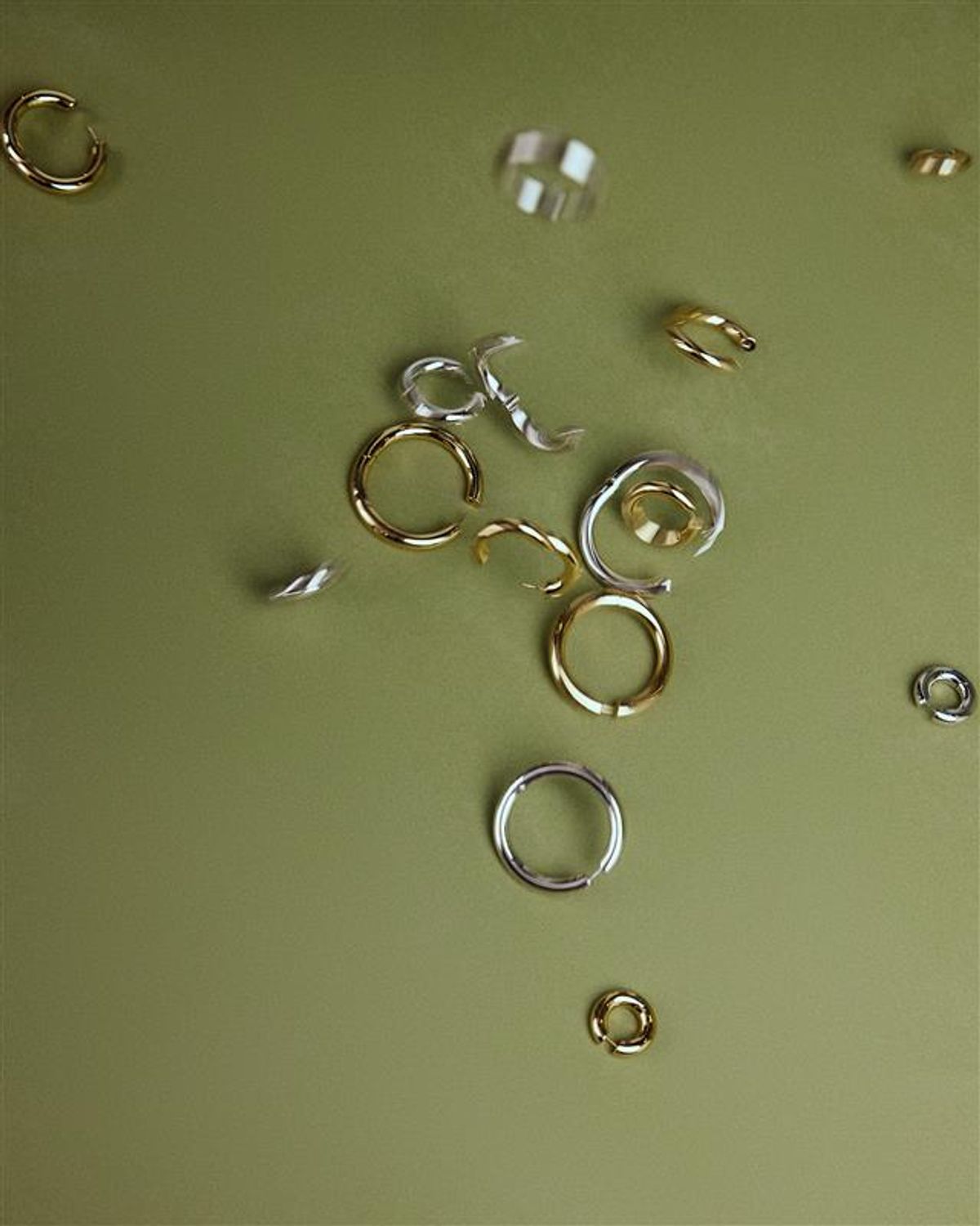 photo of green background with hoops in different colors 