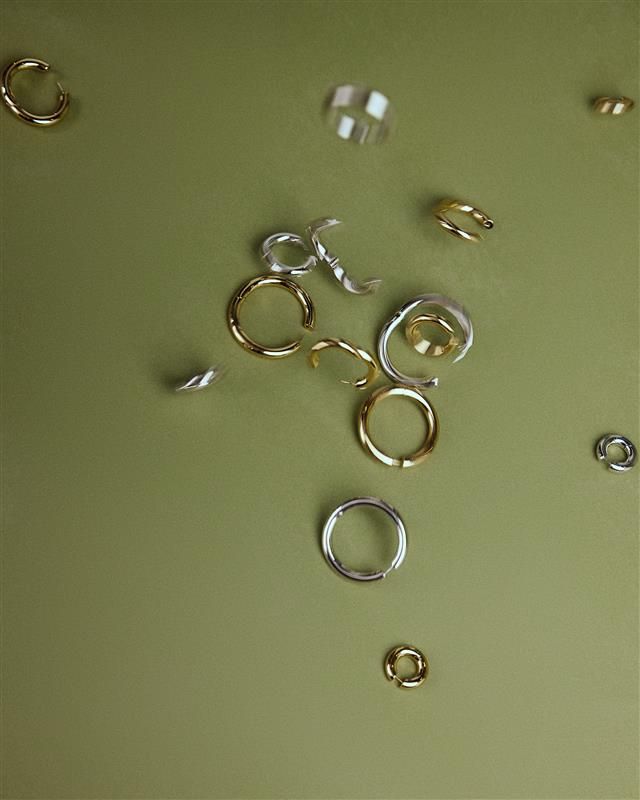 photo of green background with hoops in different colors