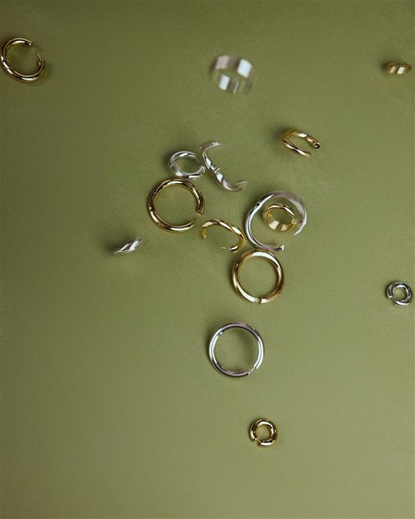 photo of green background with hoops in different colors