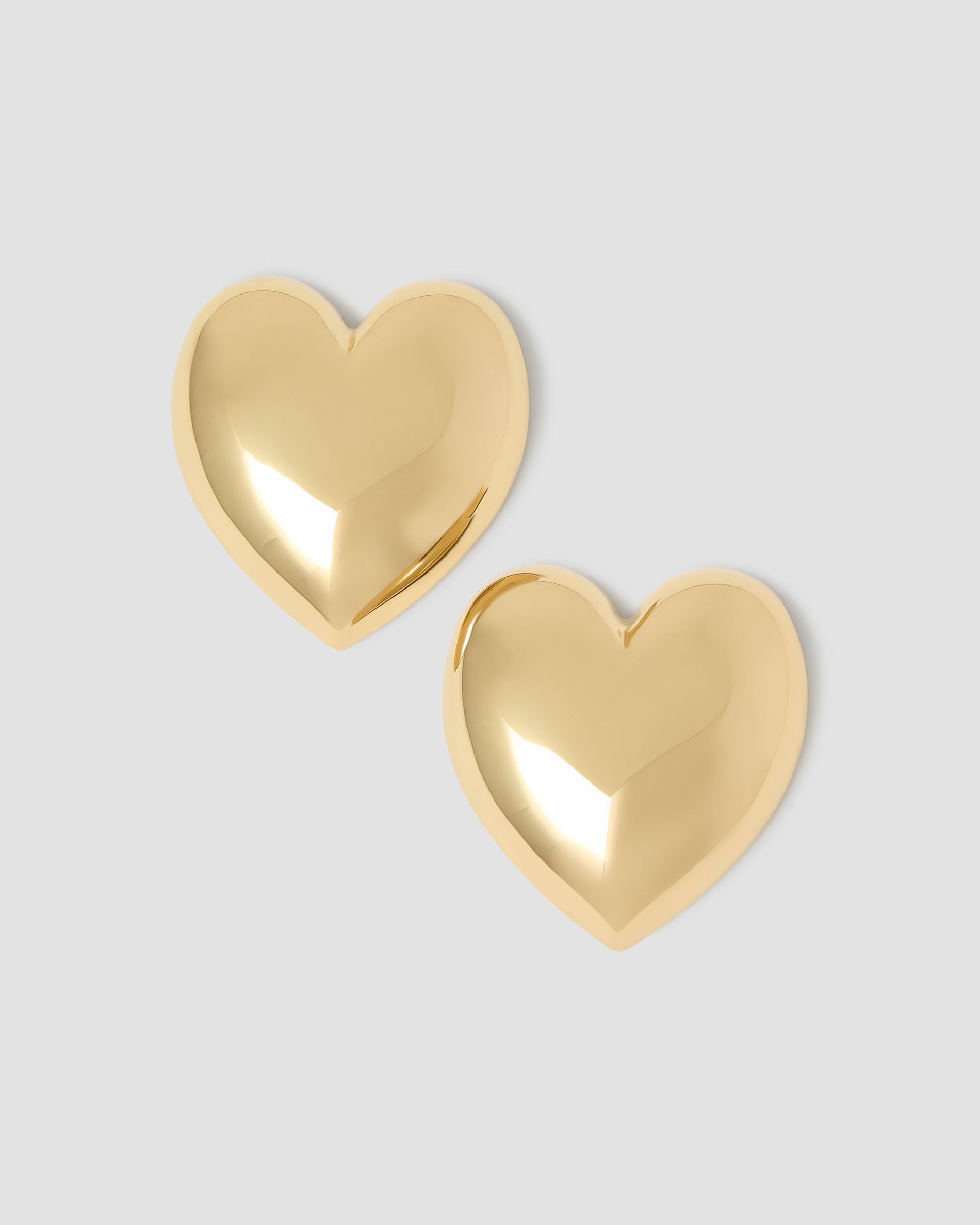 gold thin knot cuff on grey background