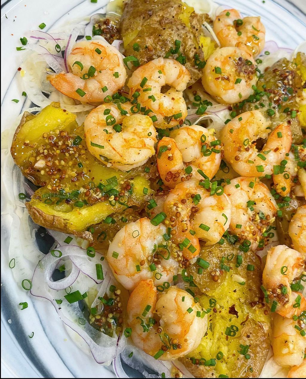 Picture of shrimp and potato's on a plate