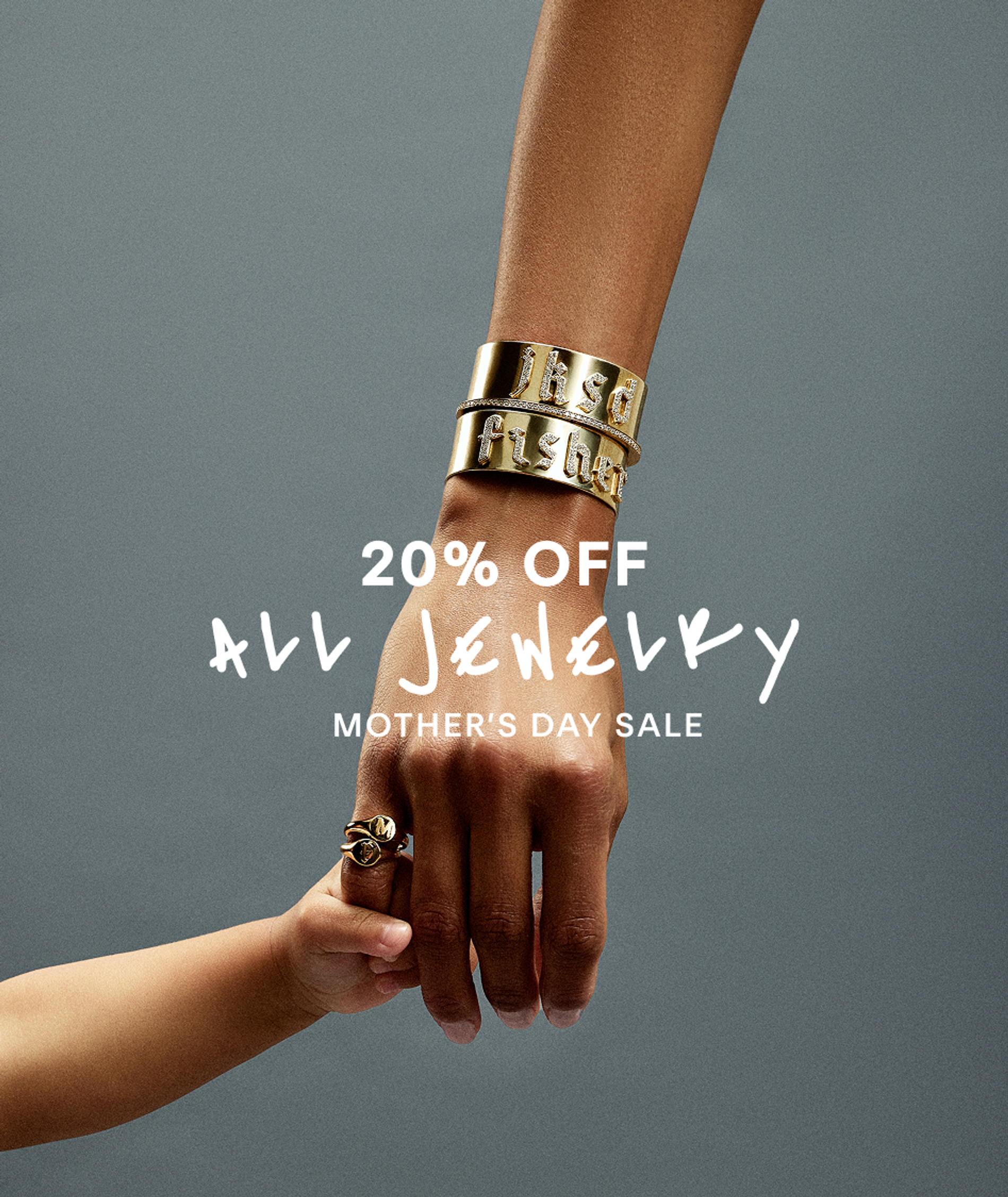 Model and baby with jennifer fisher gold bracelets and rings