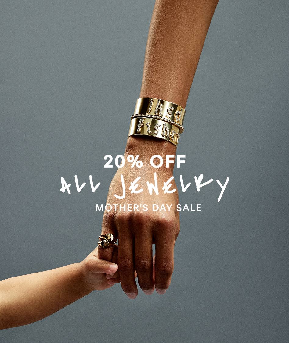 Model and baby with jennifer fisher gold bracelets and rings