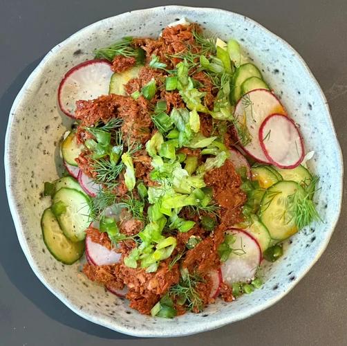 Bed of cucumber and radish topped with chorizo tuna, dill, a drizzle of chili olive oil and a dash of JF Spicy Salt.