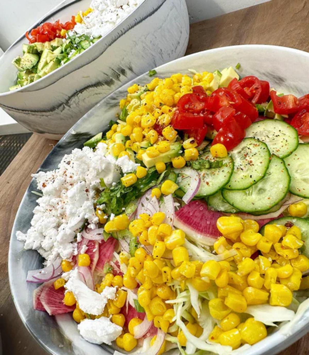 Rainbow slaw of green cabbage, watermelon radish, crumbled vegan feta, cherry tomato, avocado, cucumber, and corn. Dressed up with JF Mustard Vinaigrette and JF Spicy Salt. 