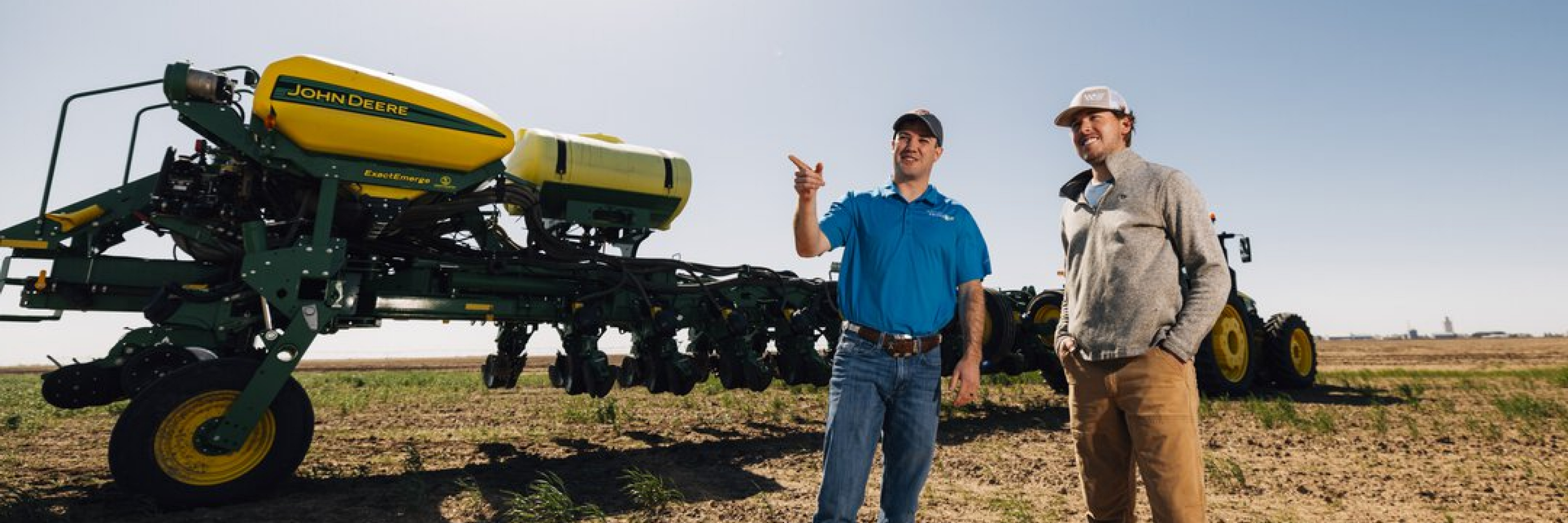 Farmer and Pivot Bio Sales Representative out in the field