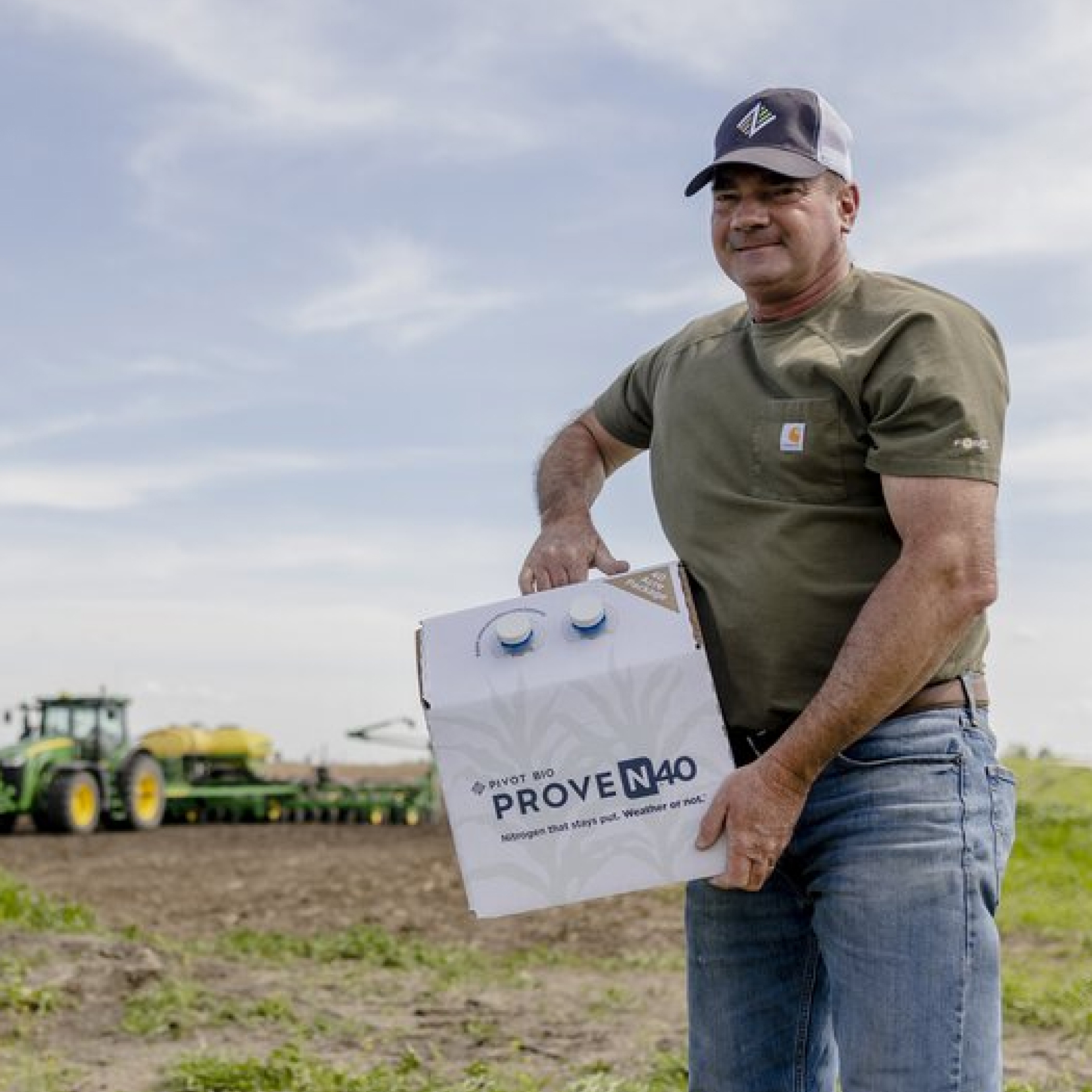 Farmer holding a box of Pivot Bio Proven40