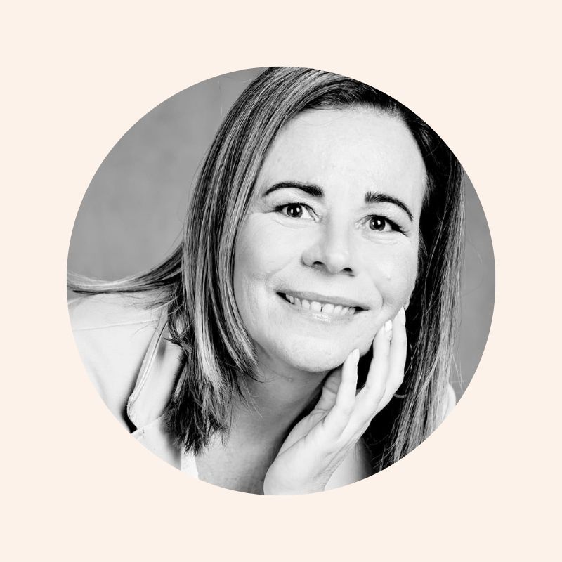 Woman enjoying food, meals in storage container, and food bowls on a table