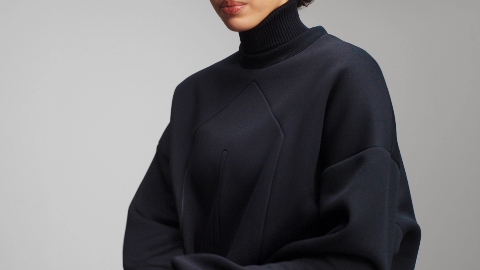 Close up of the oversized fit of Glenwood's Signature Crewneck in Taupe