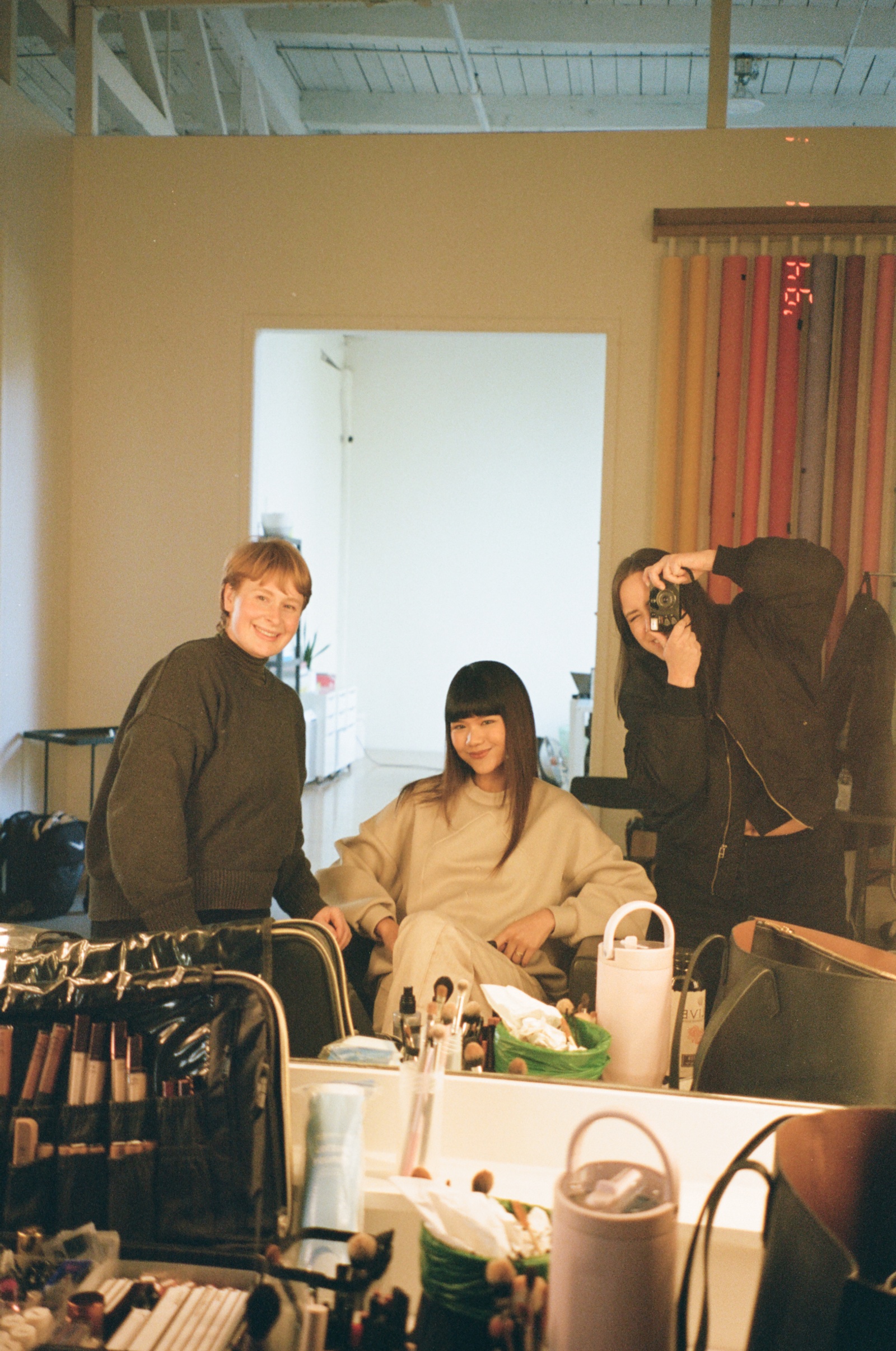 Behind the Scenes shot of Model wearing Glenwood's Signature Crewneck in Taupe – Home is a Foreign Place Collection