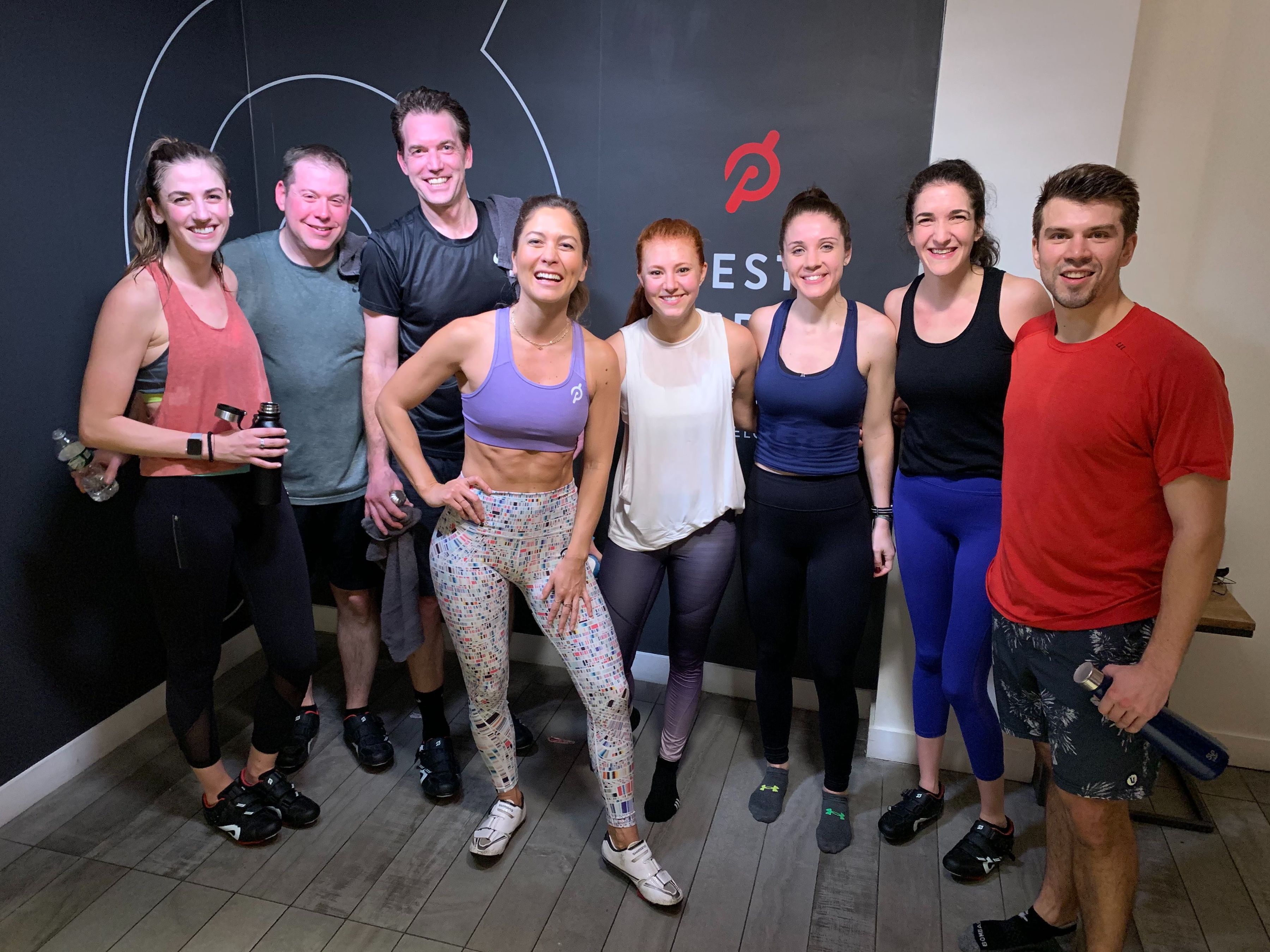 Group of colleagues at a Peloton workout class.