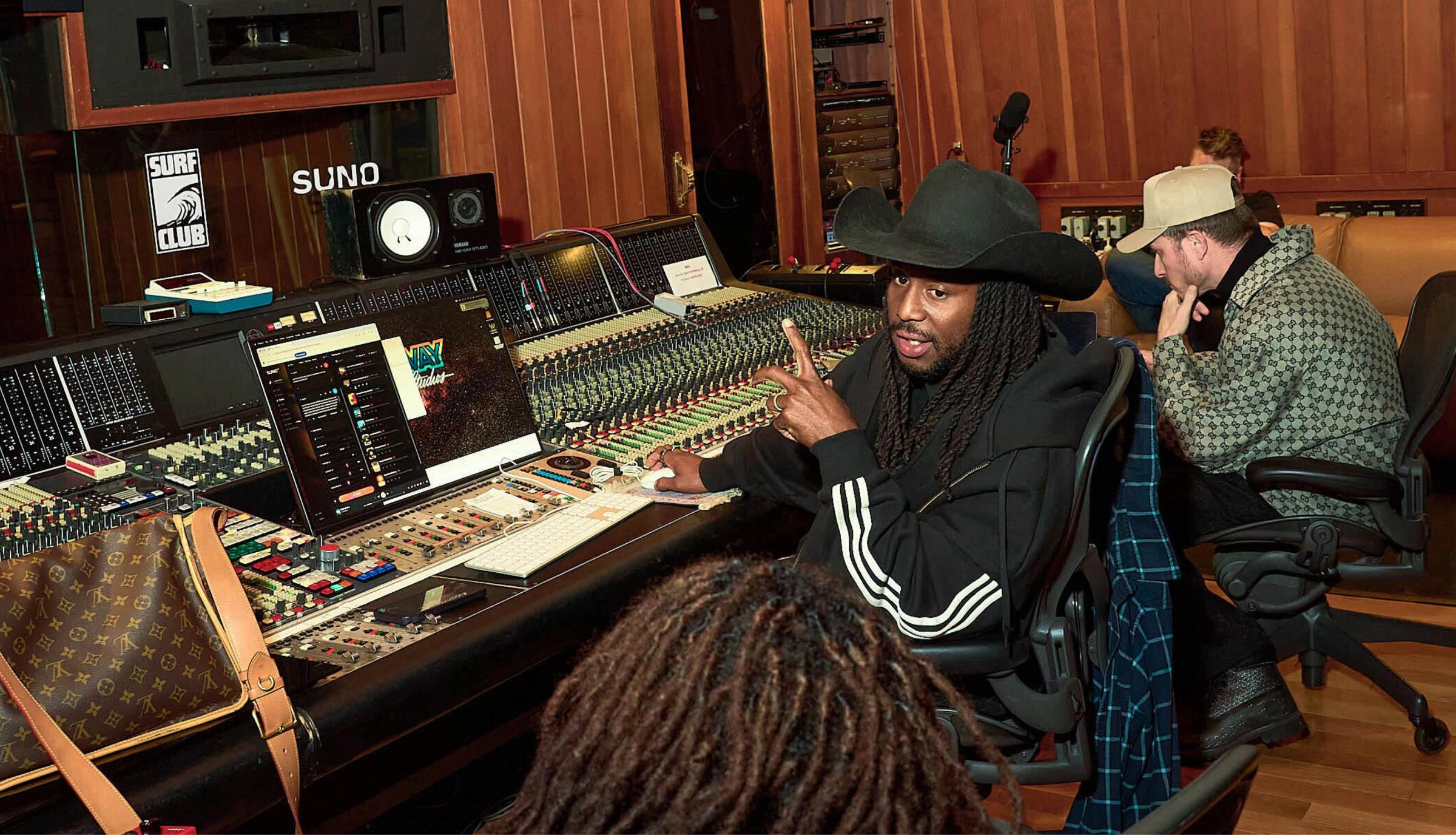 People making music in a studio using Suno