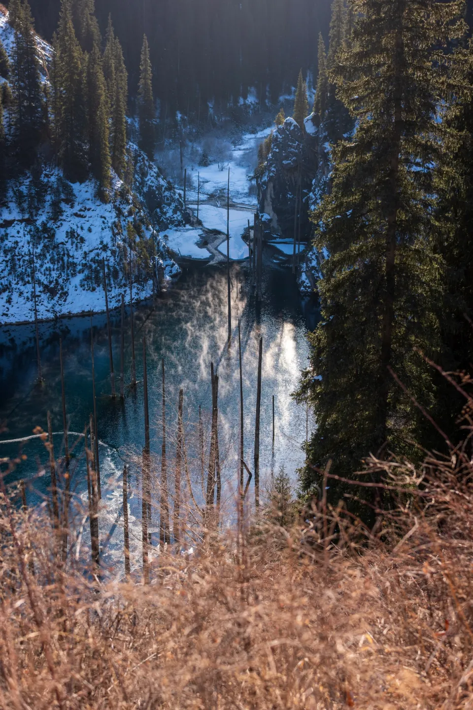 Lake Kaindy during a magical sunrise