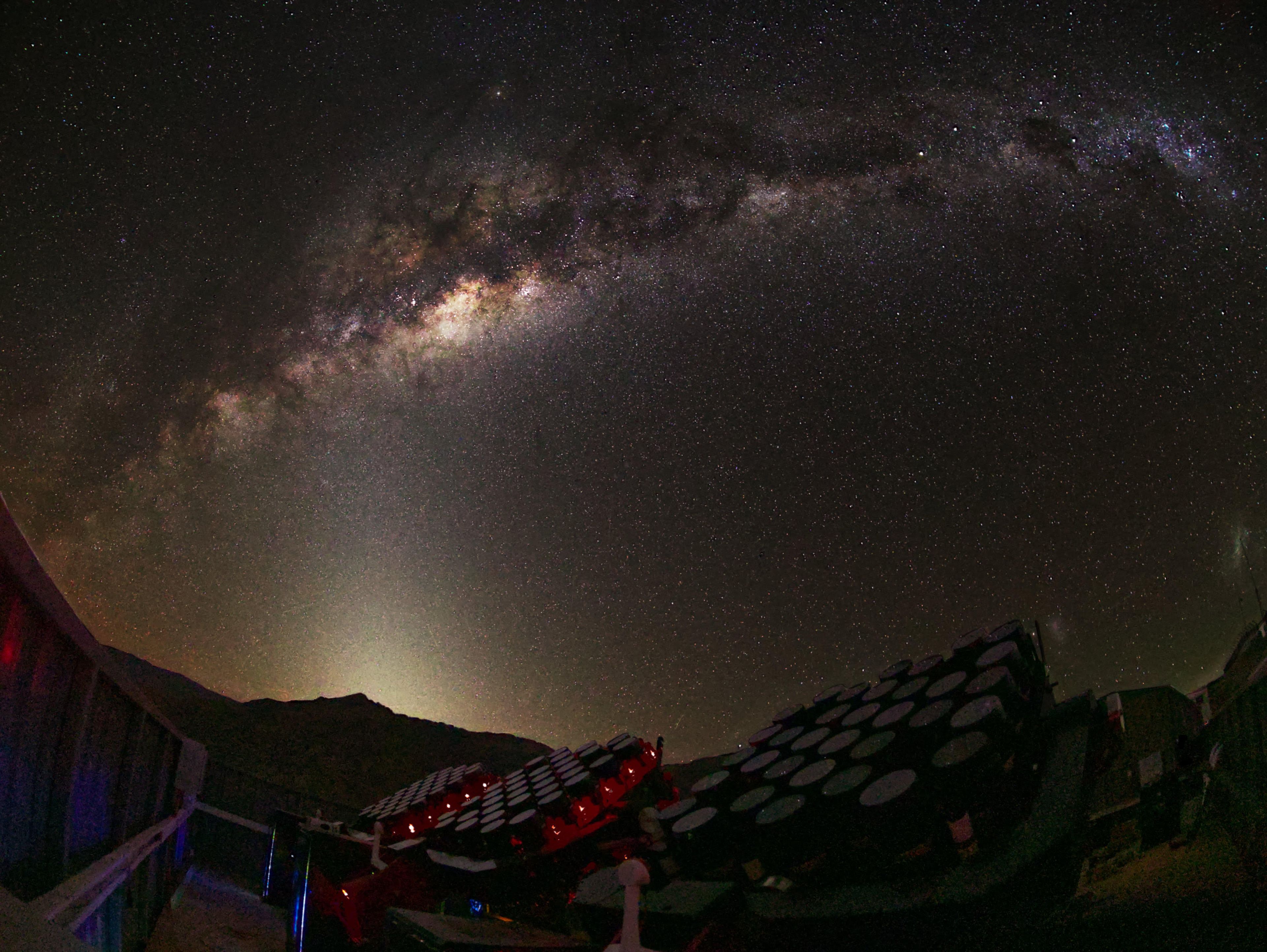 Partially completed MOTHRA array observing under the Milky Way at El Sauce Observatory in Chile. Several mounts of the telescope are visible as they take data beneath one of the darkest skies on Earth.