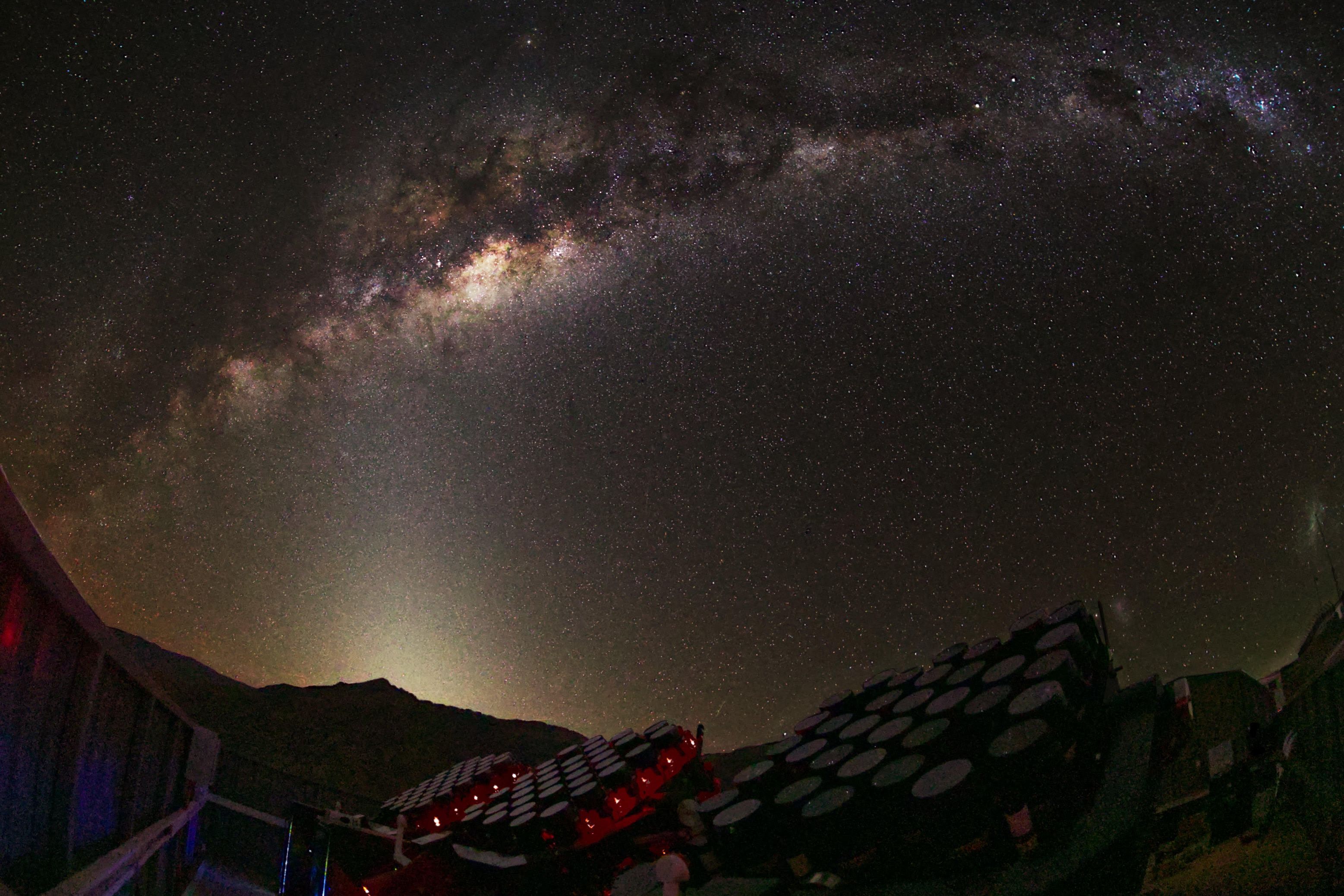 Partially completed MOTHRA array observing under the Milky Way at El Sauce Observatory in Chile. Several mounts of the telescope are visible as they take data beneath one of the darkest skies on Earth.