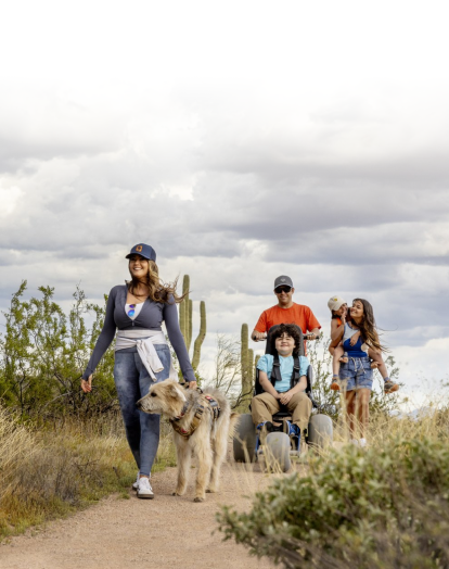 family walking in arizona's desert