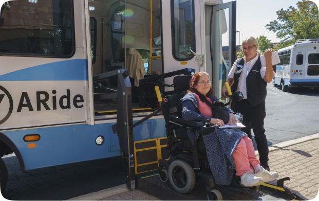 Ann Arbor public transit bus and a woman in wheelchair getting the bus 