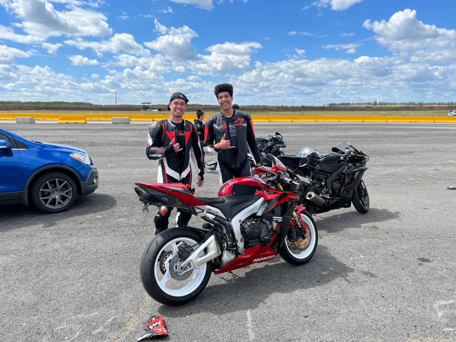 two young men with motorcycles