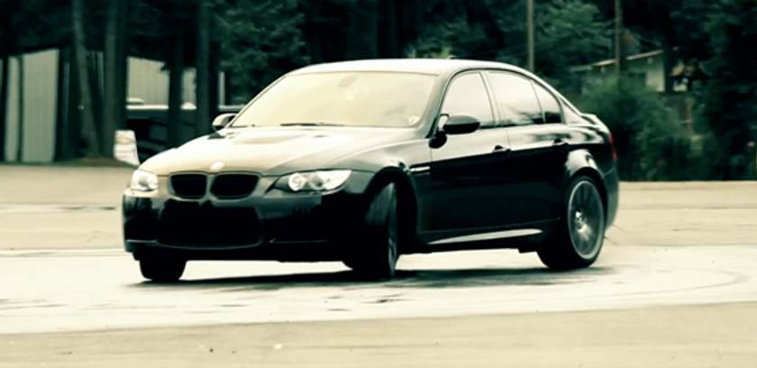BMW sliding in wet conditions.  Photo by Christian Bouchez.
