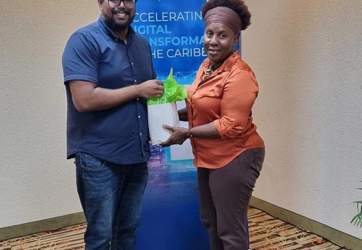 A photo of a participant presenting Caribbean Export's Jonathan Seecharan with a token of appreciation