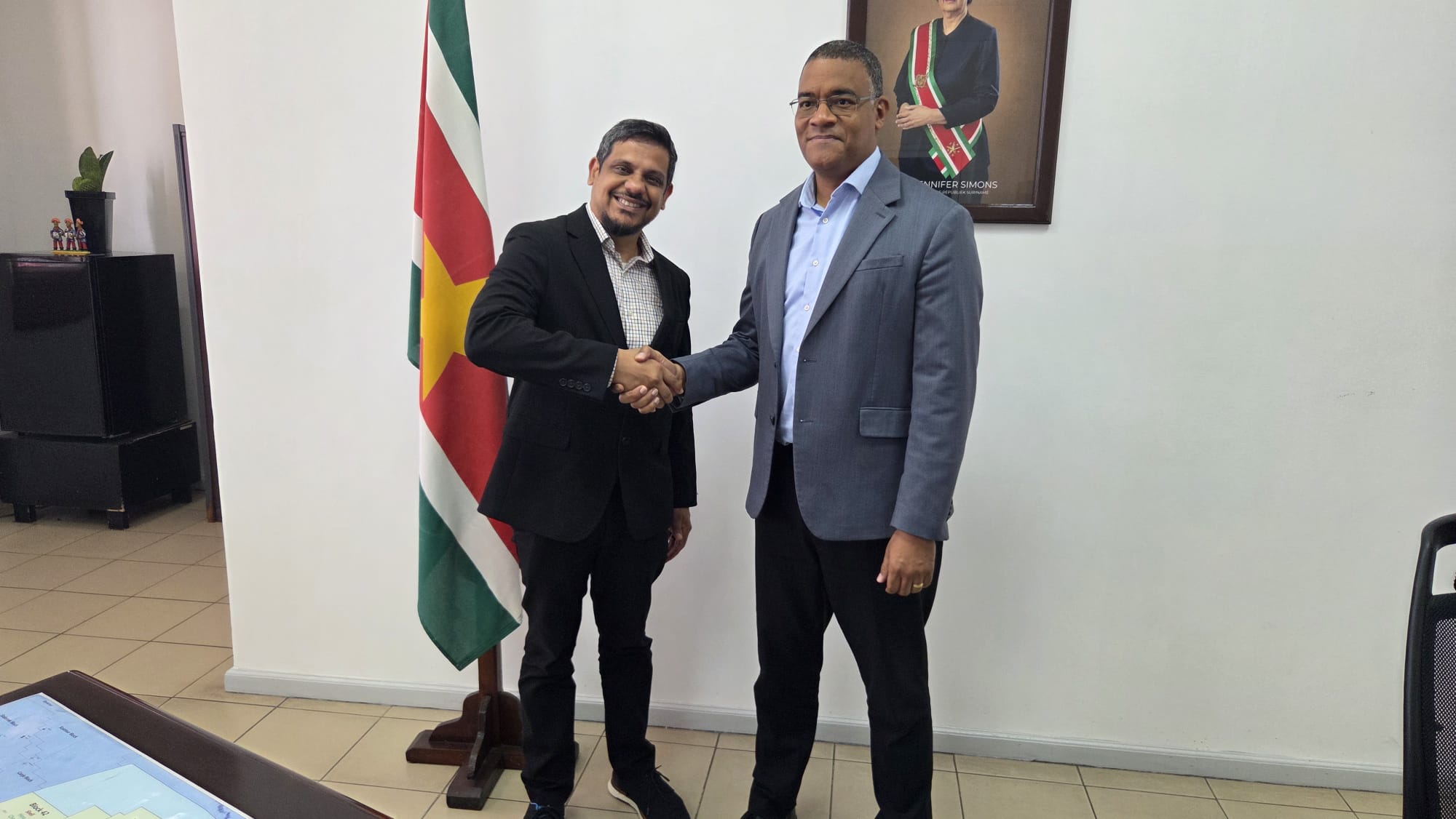 Dr Damie Sinanan greets the Honourable Andrew Baasaron