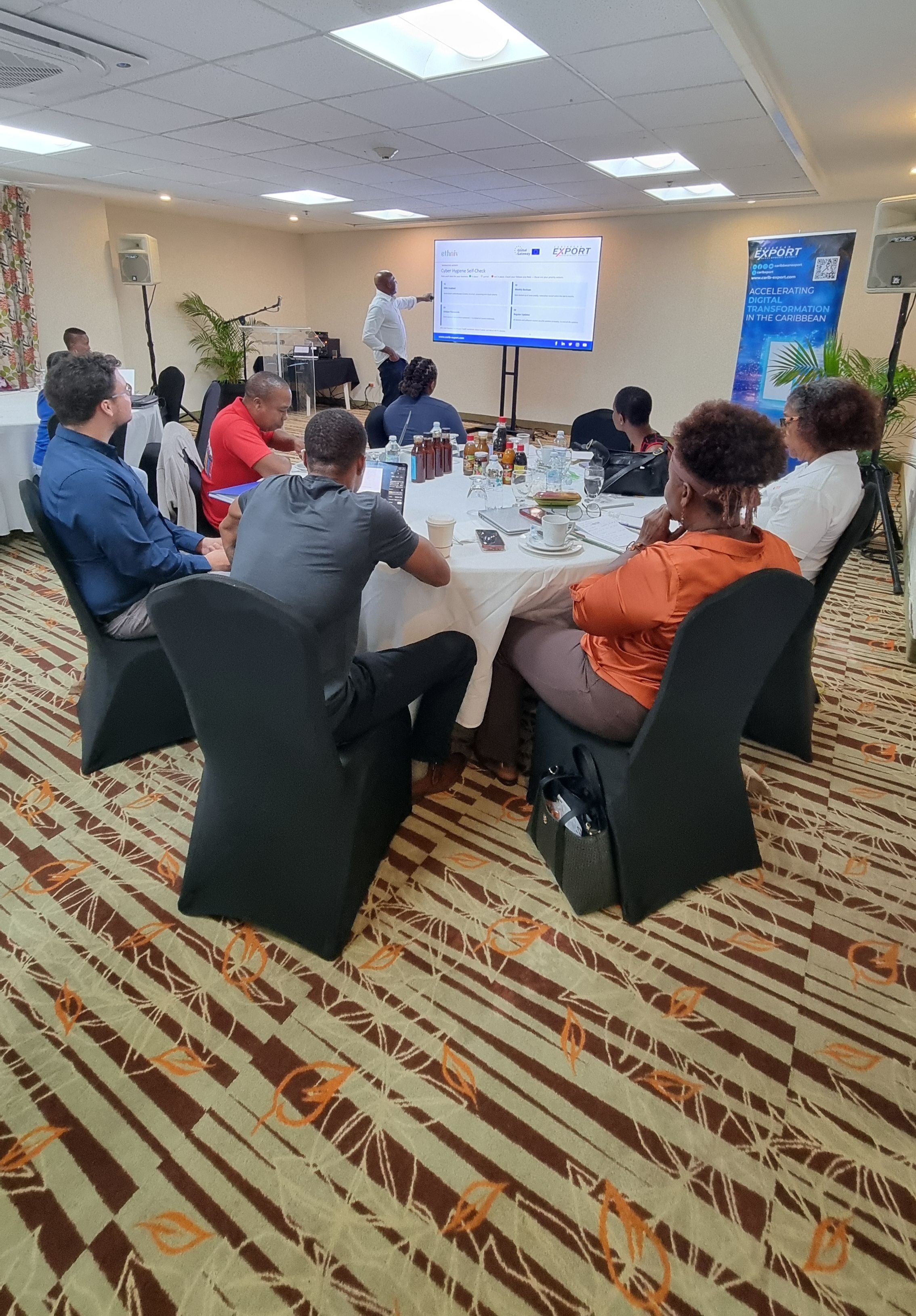 A photo of a cross-section of Digital Bootcamp participants listening to the Facilitator