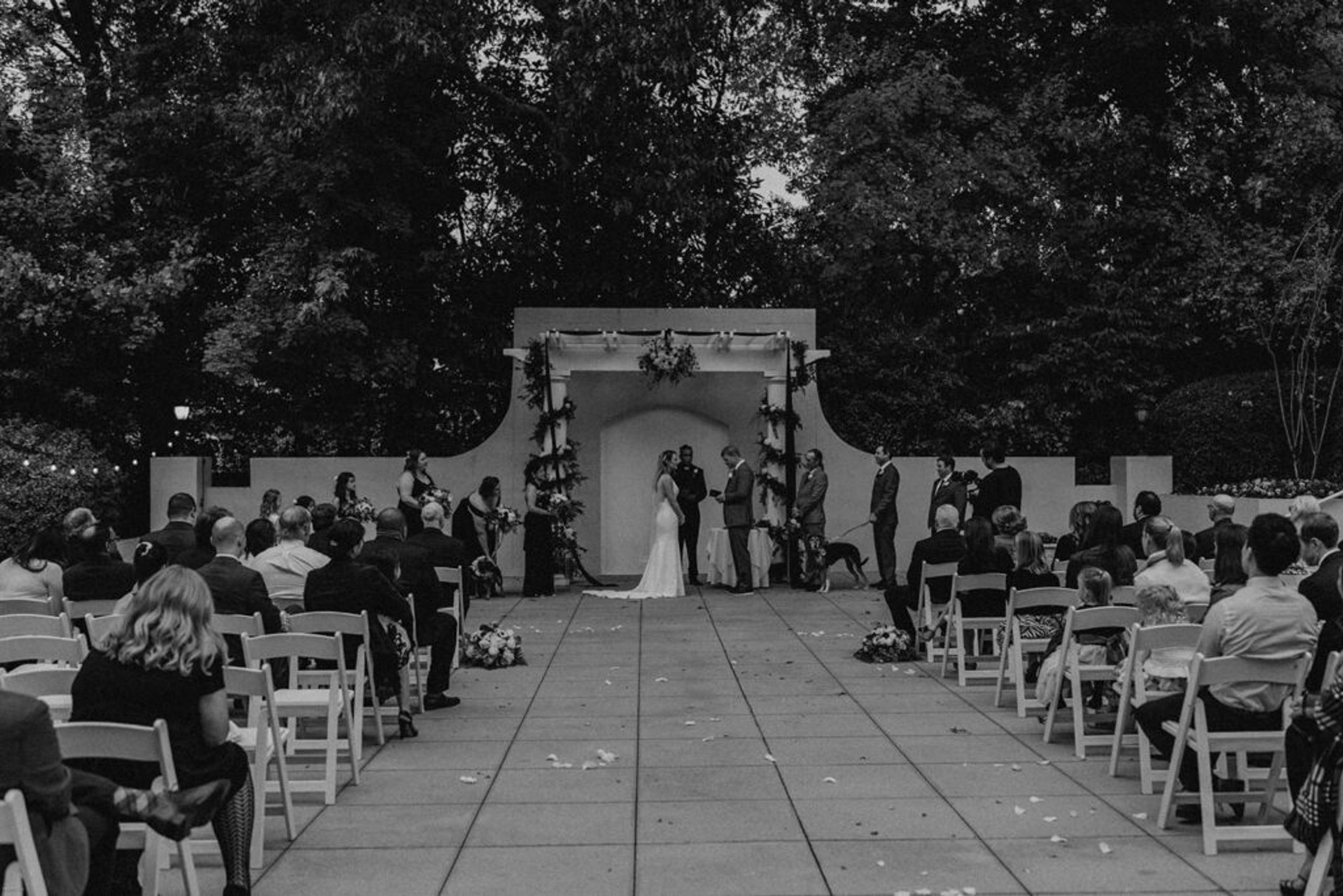 Scott and Deb stand together at the altar, exchanging vows at 173 Carlyle House.
