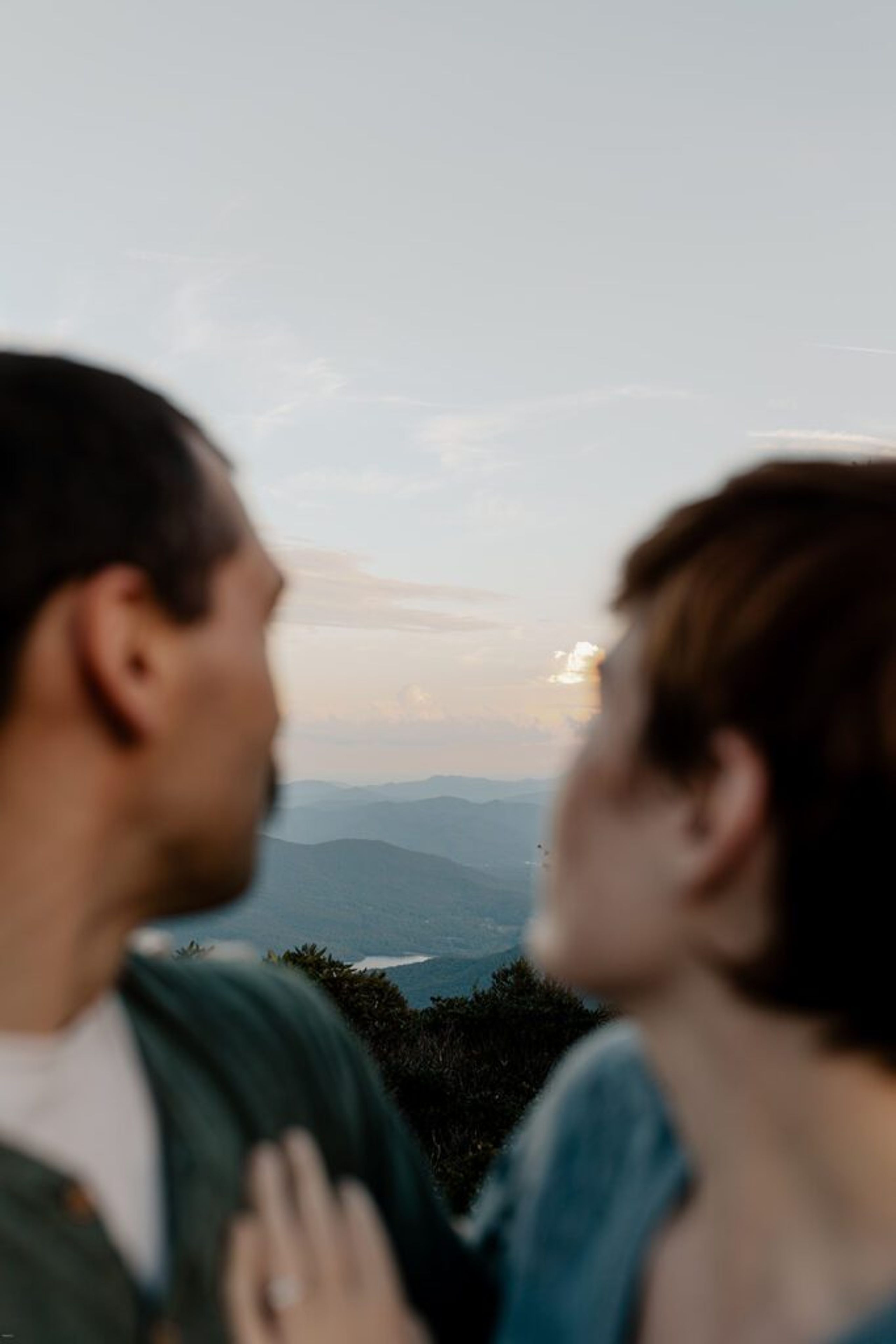 Couple looking out over the mountains during their Craggy Gardens engagement session.