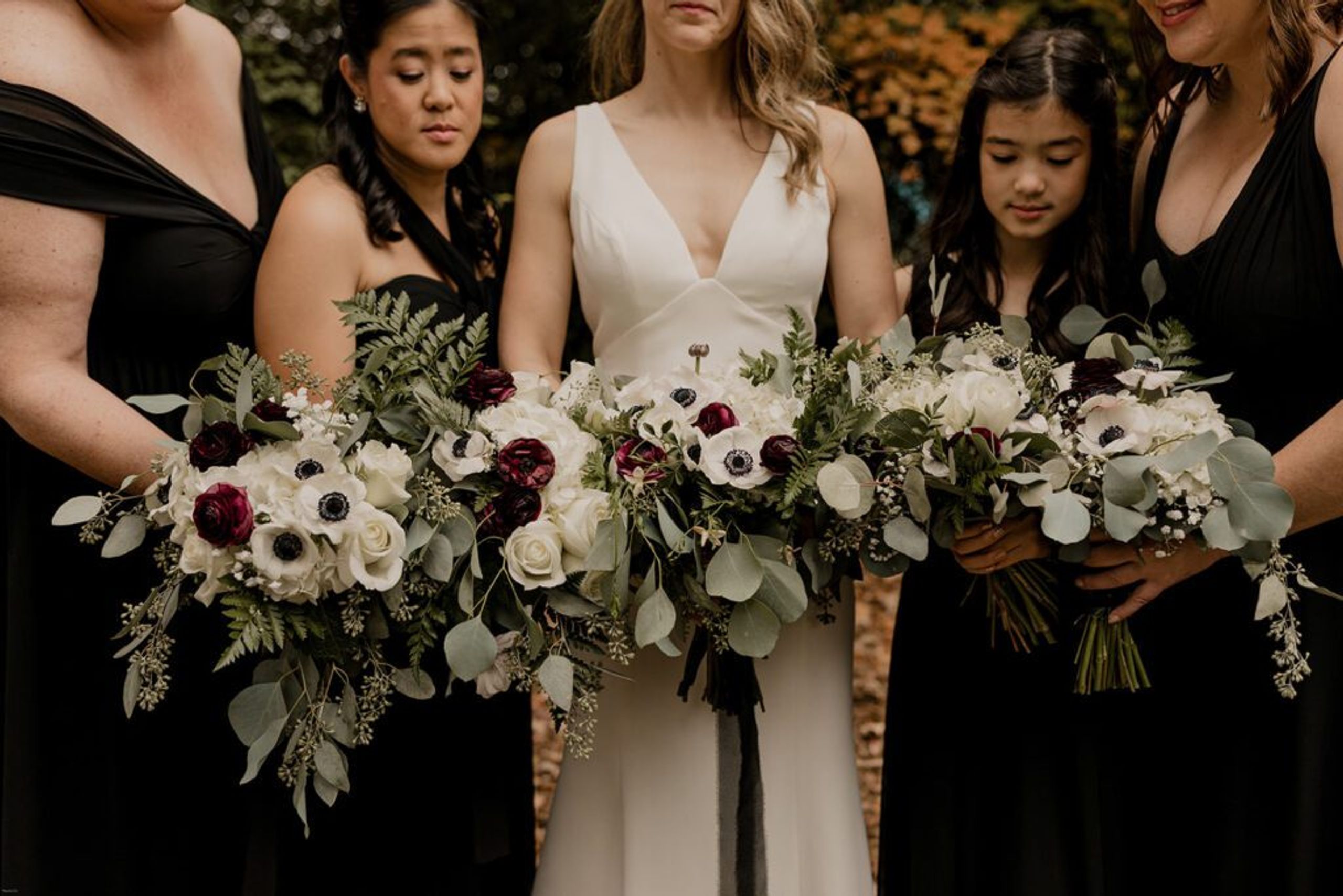 A close-up of Deb’s bouquet with white and burgundy flowers, held at 173 Carlyle House.