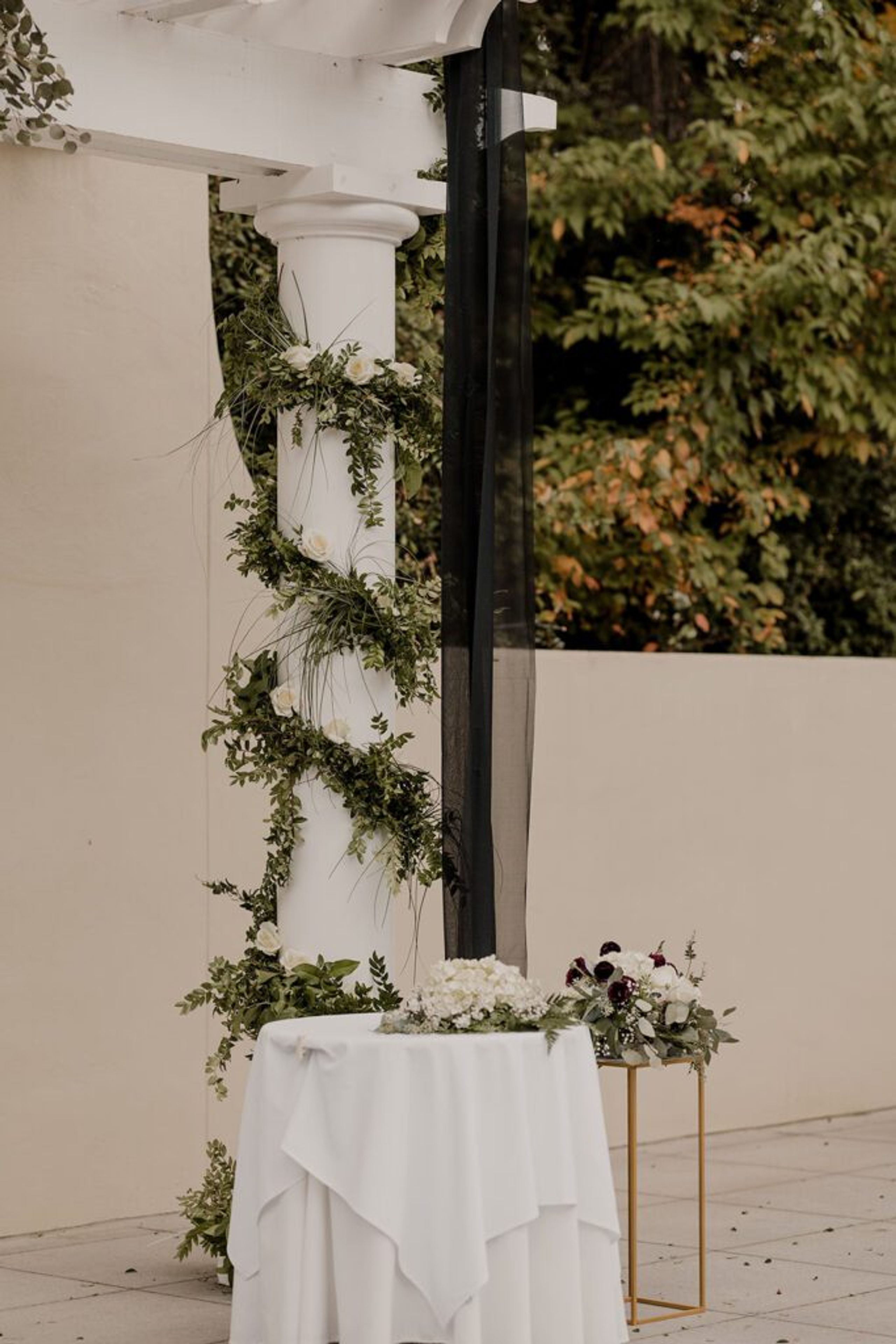 A beautifully decorated wedding arch with greenery, ready for the ceremony at 173 Carlyle House.