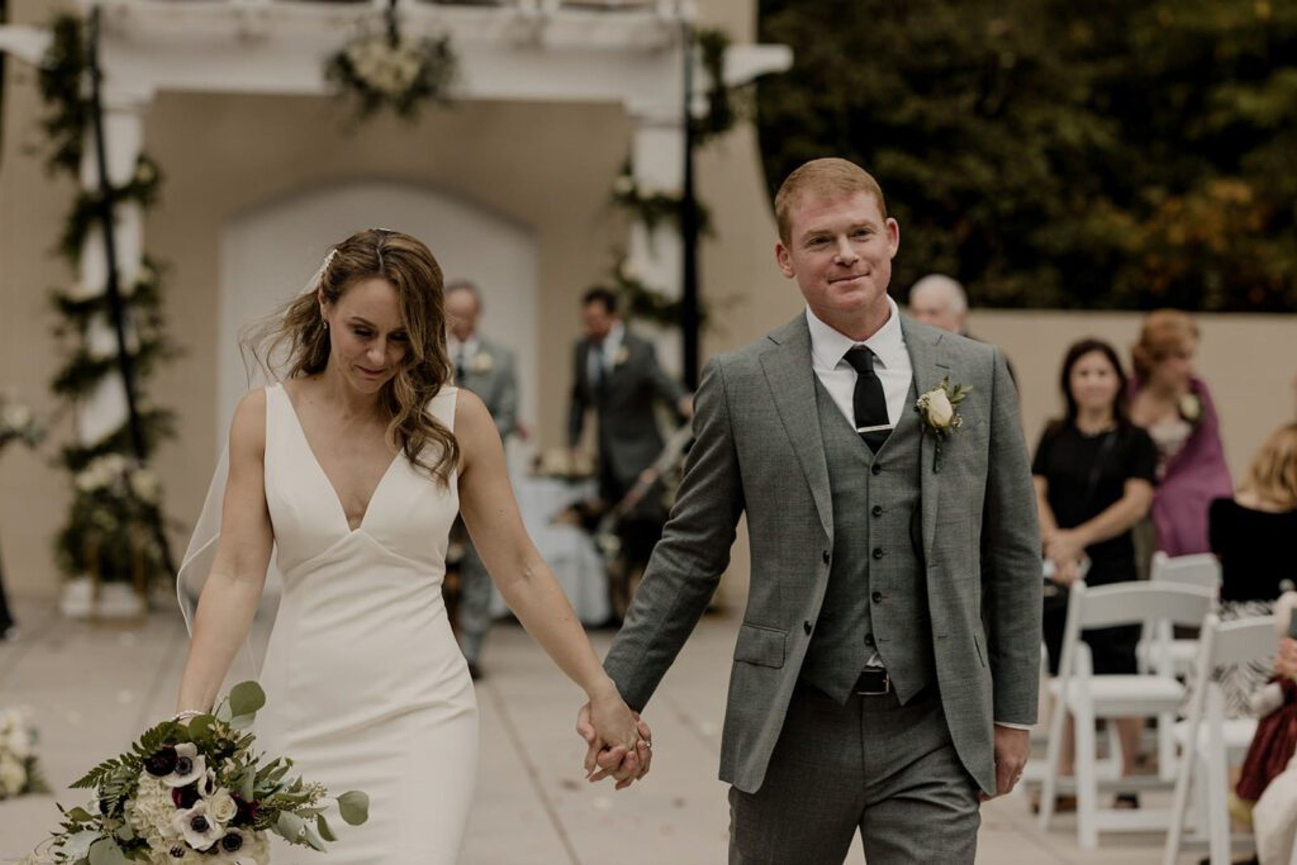 Scott and Deb walk hand in hand down the aisle after their ceremony at 173 Carlyle House, filled with happiness.