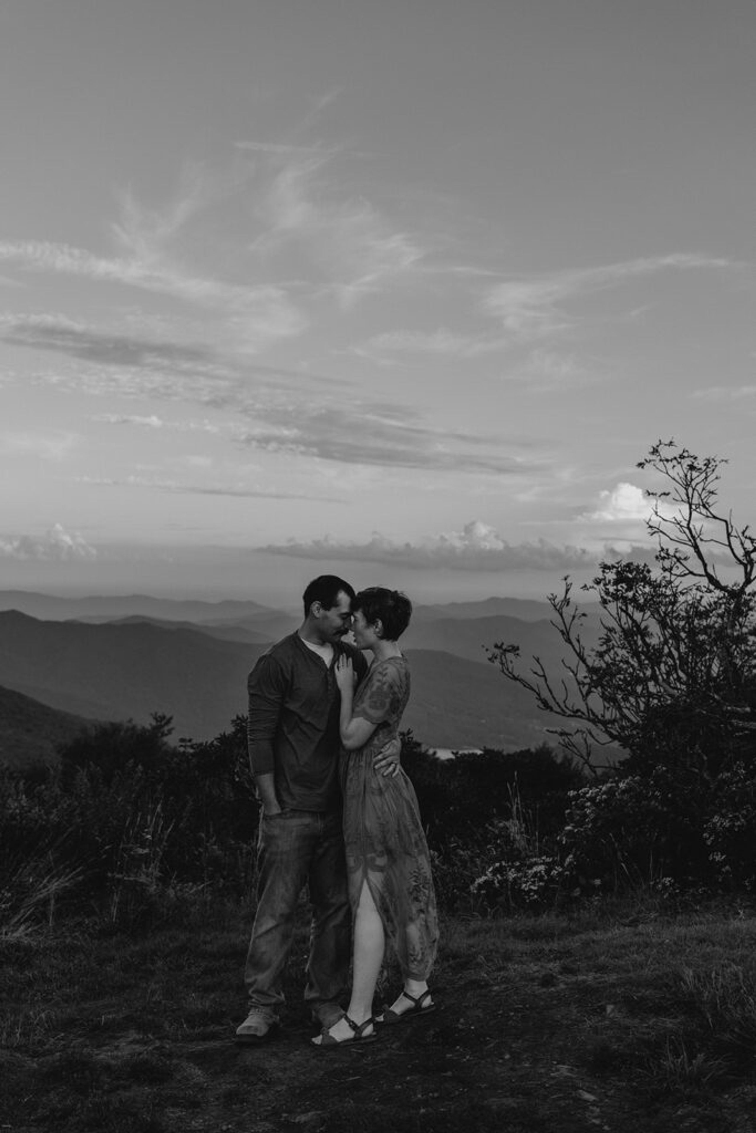 Couple sharing an intimate moment with mountain views at Craggy Gardens.