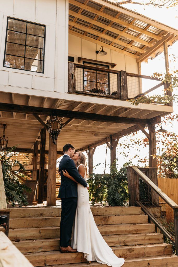 A couple embraces on the steps of a rustic Airbnb property, followed by a close-up of the bride's serene expression as she smiles softly, showcasing the intimate and personal nature of their elopement.