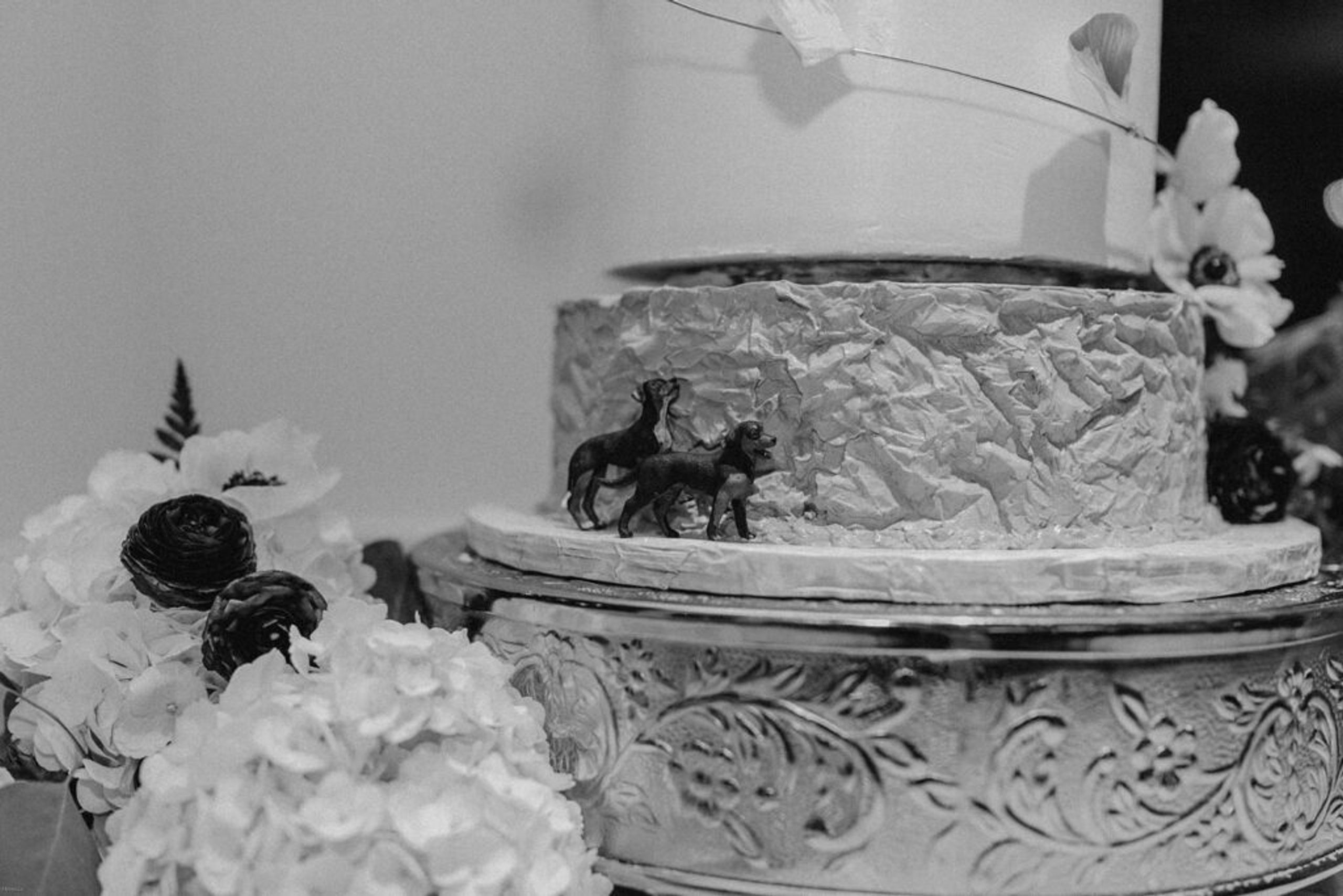 A close-up of the wedding cake, featuring intricate details and floral decorations at 173 Carlyle House.