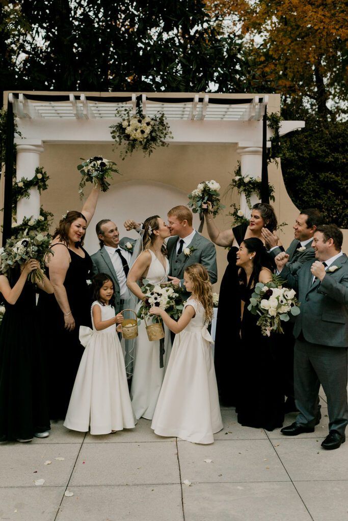 The bridal party celebrates with Scott and Deb after their ceremony at 173 Carlyle House.