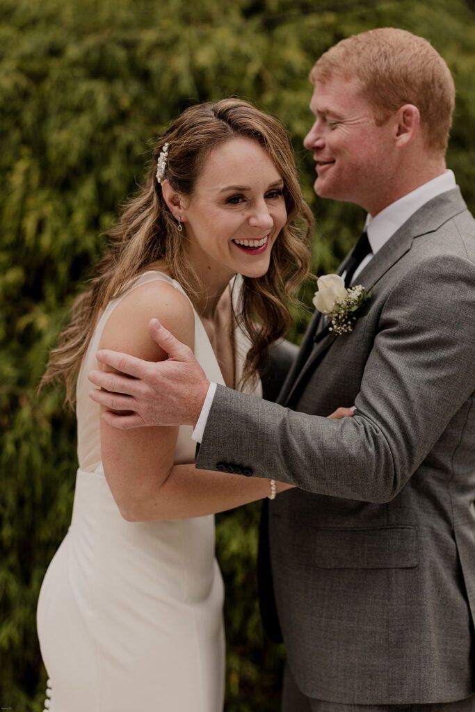Deb and Scott embrace lovingly, smiling as they celebrate their marriage.