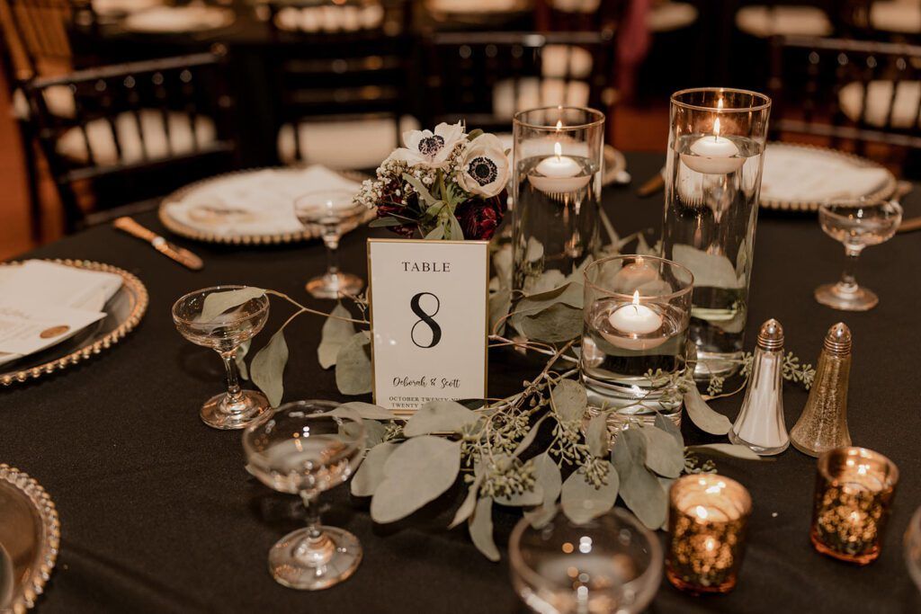 A beautifully arranged table setting with candles and florals for the wedding reception at 173 Carlyle House.