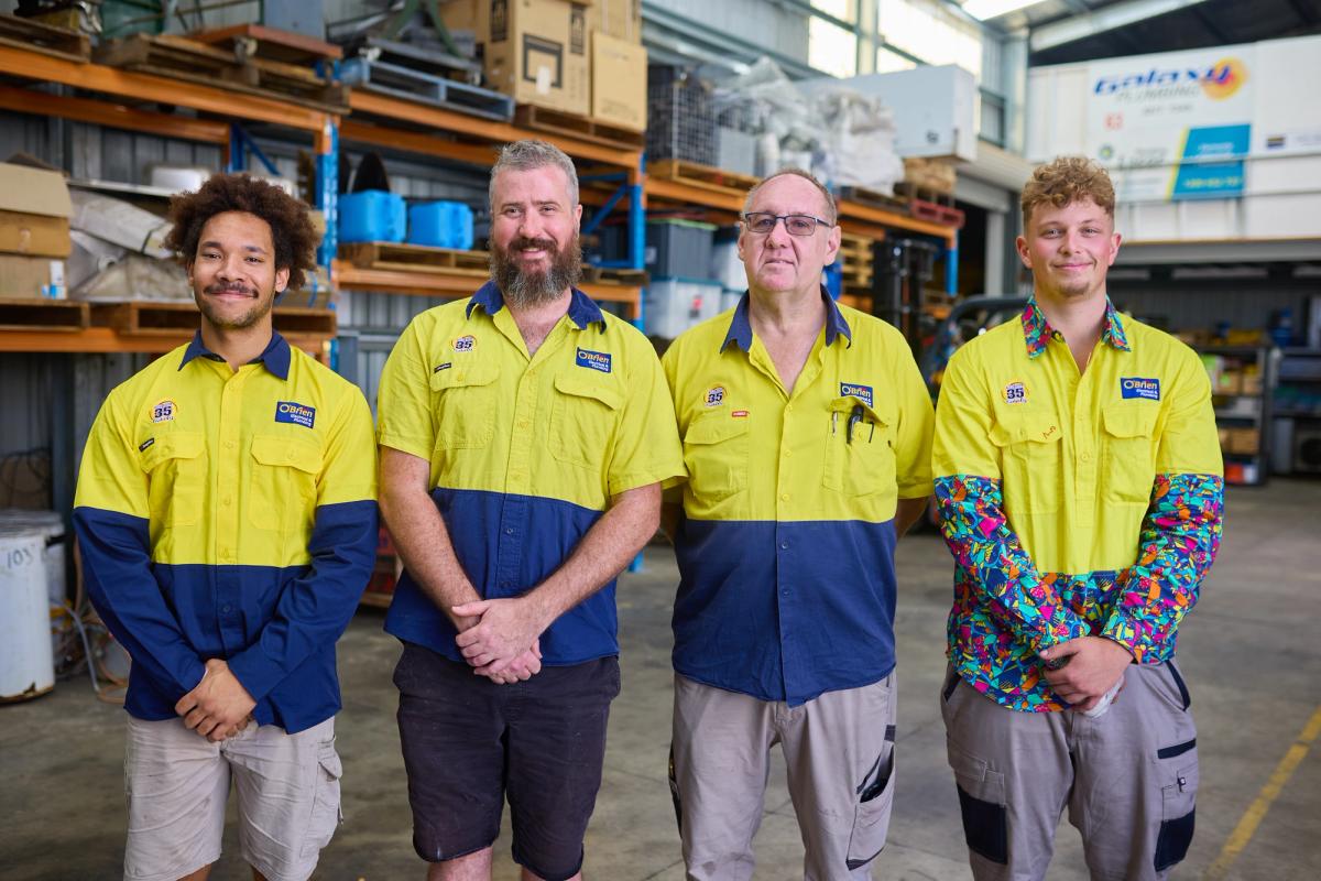 Four members of the O’Brien Coopers Plains team in the branch workshop