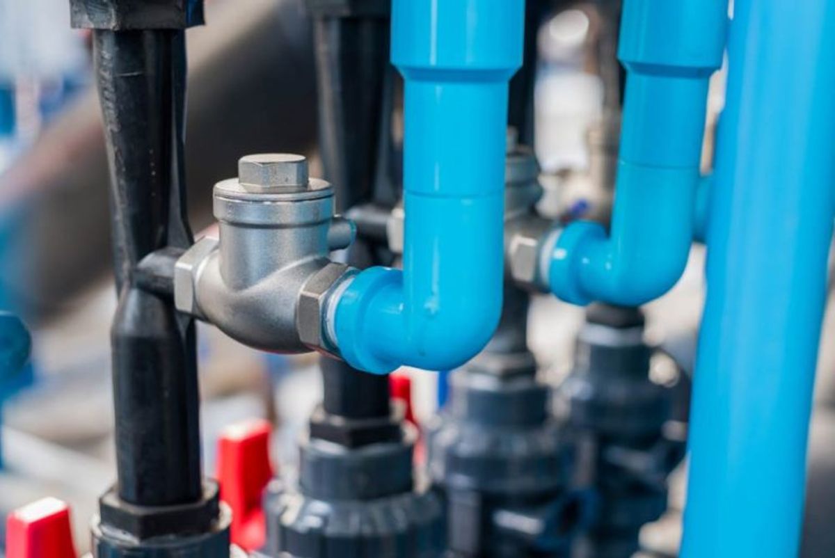Blue and black pipework fitted with a backflow prevention valve