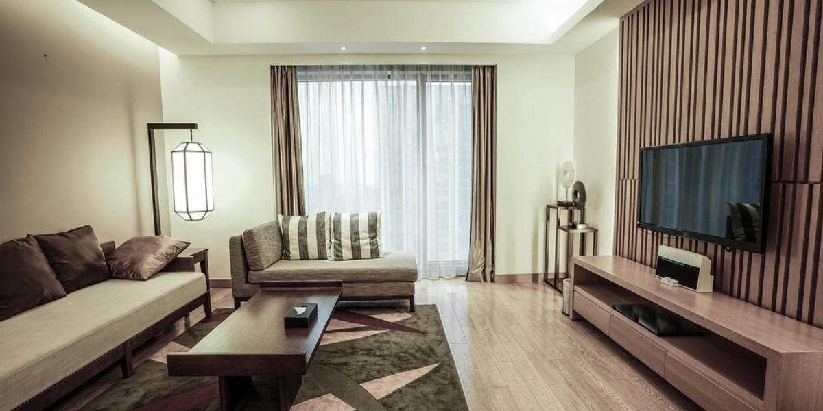 A modern living room with recessed and feature lighting