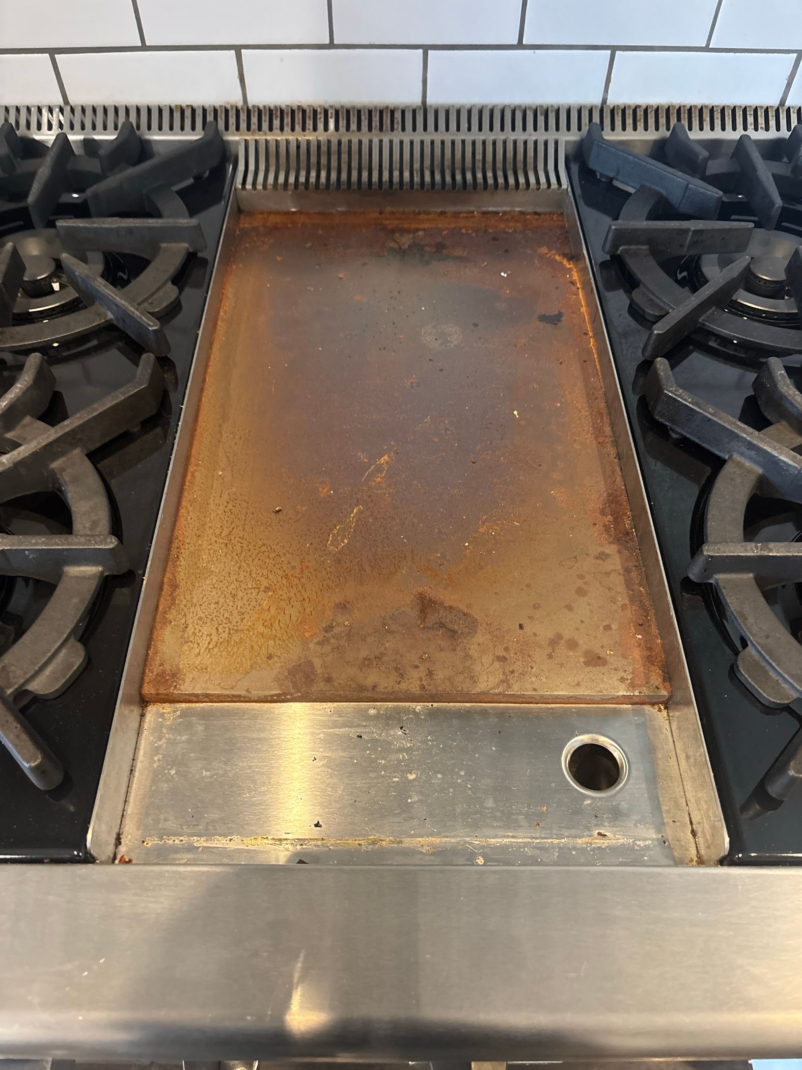 A Wolf Range With a Rusted Griddle Replaced in Avondale, Chicago (photo 1)
