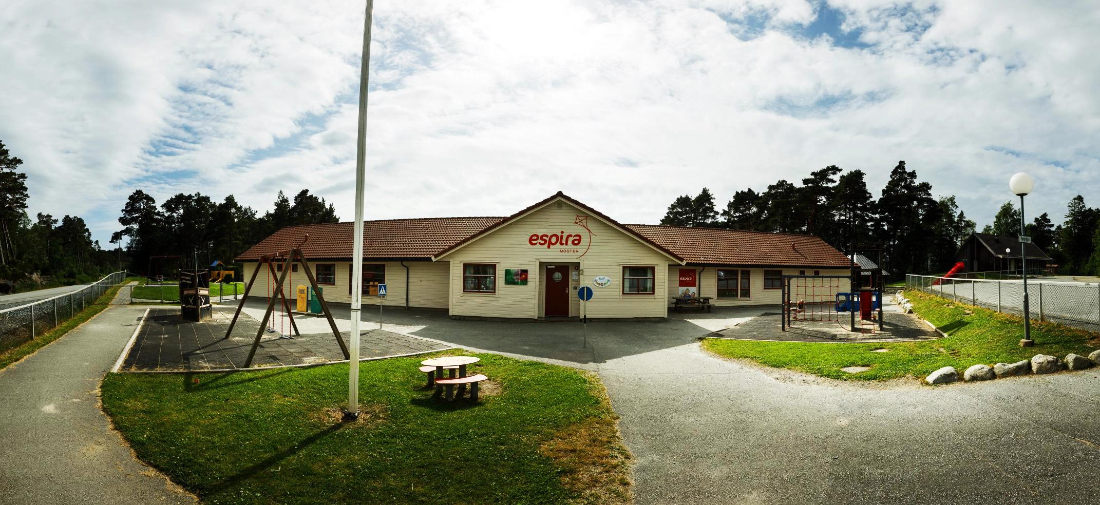 a large building with a playground in front of it .
