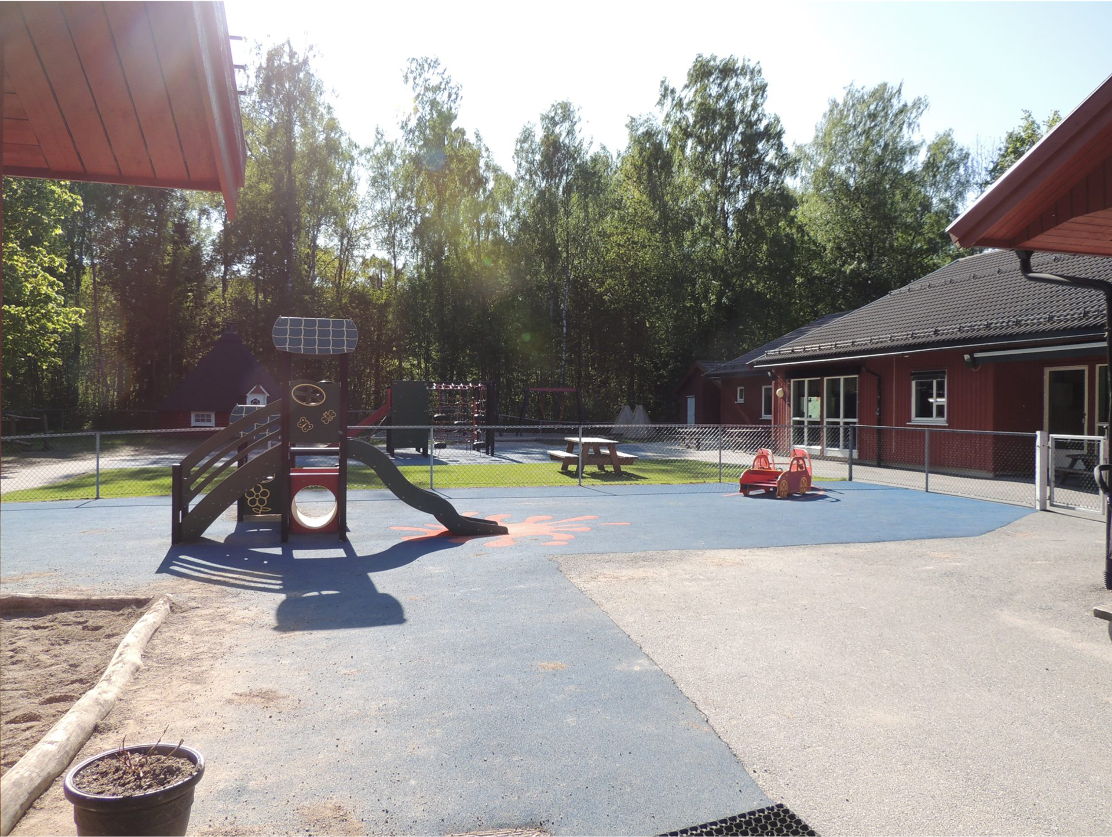 a playground with a slide that has a solar panel on it