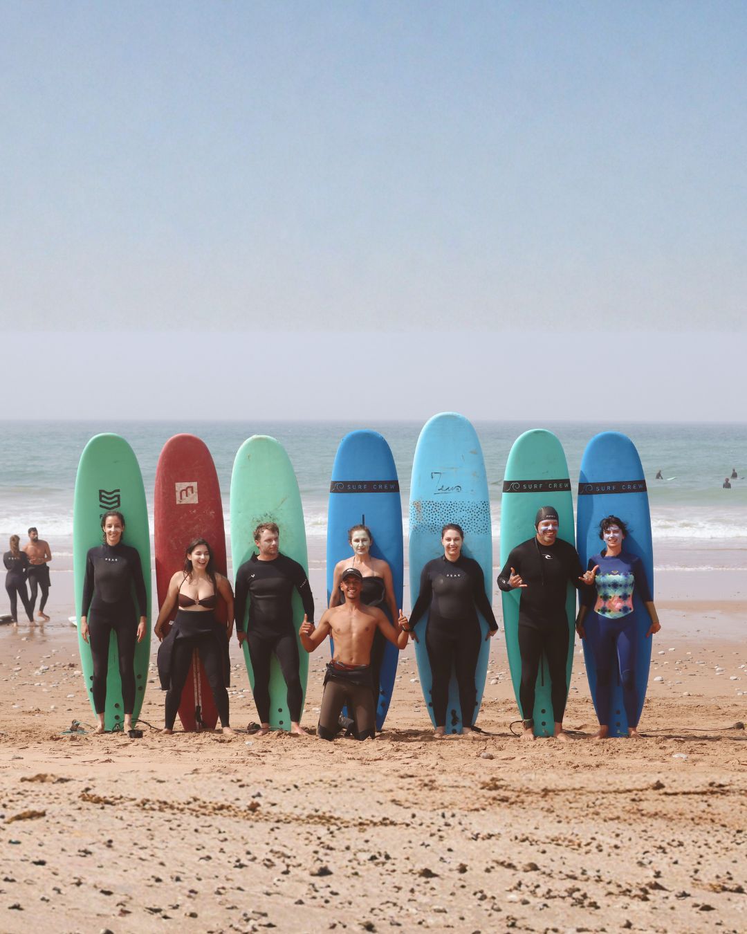 The Sea Me Smile crew lined up on the beach before a coaching session near Tamraght