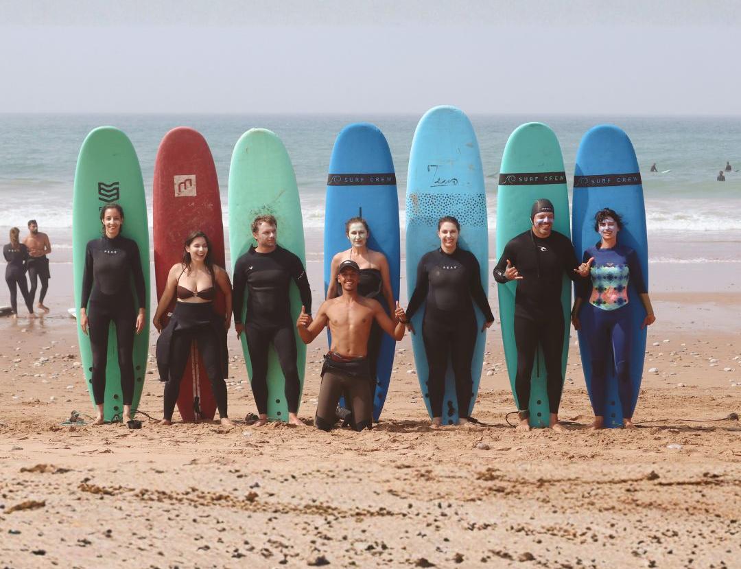The Sea Me Smile crew lined up on the beach before a coaching session near Tamraght