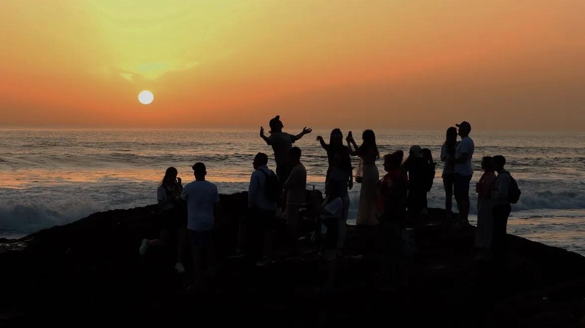 Surf camp guests experiencing the sunset at Anchor Point, Taghazout 